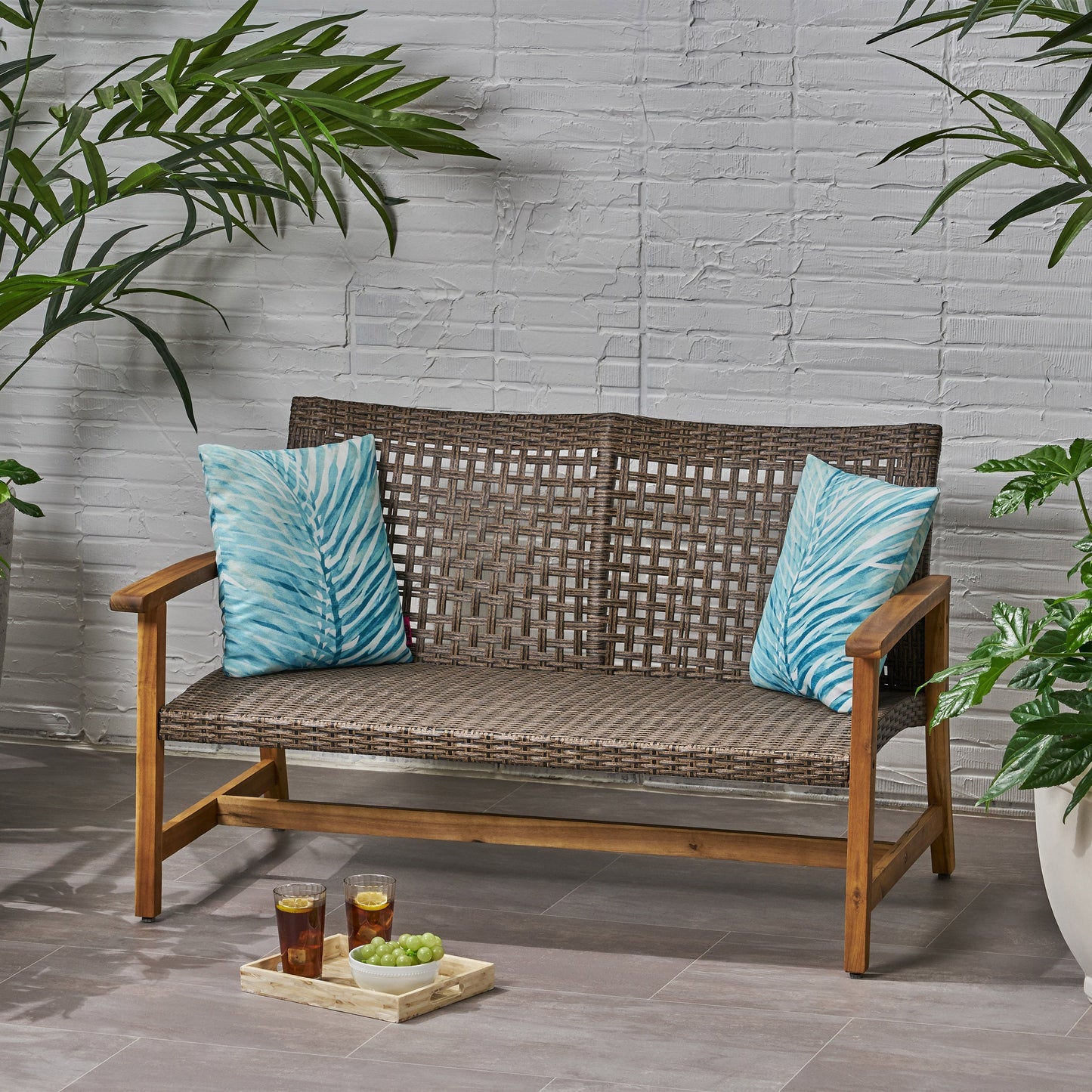 Hampton Outdoor Acacia Wood Wicker Loveseat with brown weave and blue cushions on Tampa Home & Garden Store