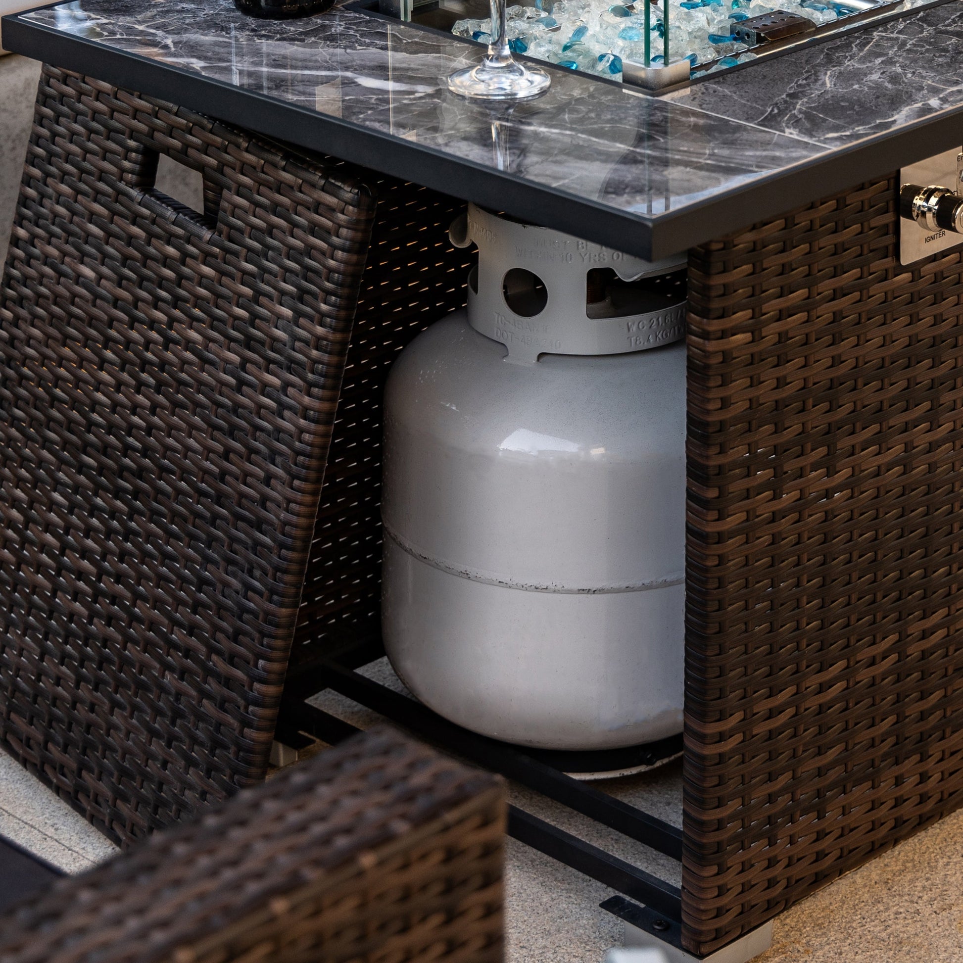 44' Propane Gas Fire Pit Table with dark marble tile top and brown wicker base on Tampa Home & Garden Store