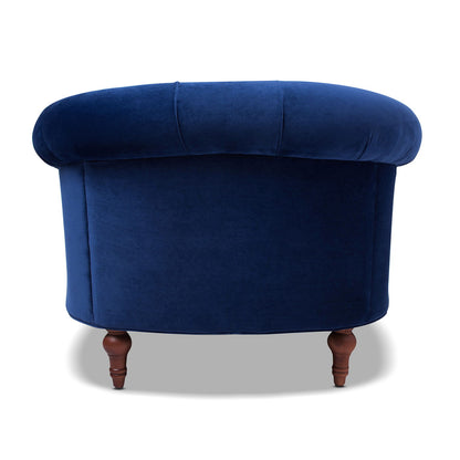 Victorian-style accent chair in royal blue velvet with a curved back and turned wood legs on Tampa Home & Garden Store