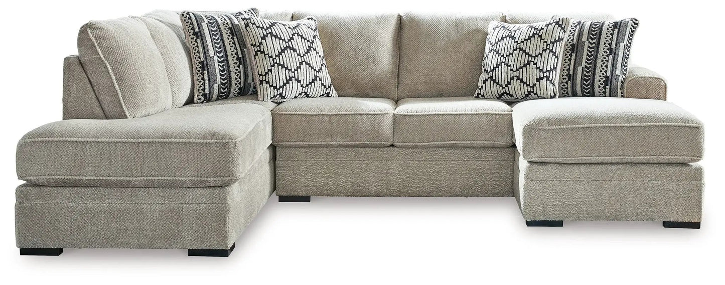 Calnita stationary L-shaped sectional sofa, beige boucle fabric with patterned cushions on Tampa Home & Garden Store