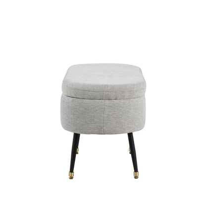 Contemporary storage bench with light gray fabric upholstery and black legs on Tampa Home & Garden Store