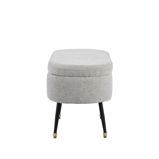 Contemporary storage bench with light gray fabric upholstery and black legs on Tampa Home & Garden Store