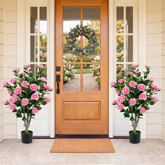 Artificial Camellia Tree 39.5 in with Cement Pot two pink faux trees flank a wood front door on Tampa Home & Garden Store