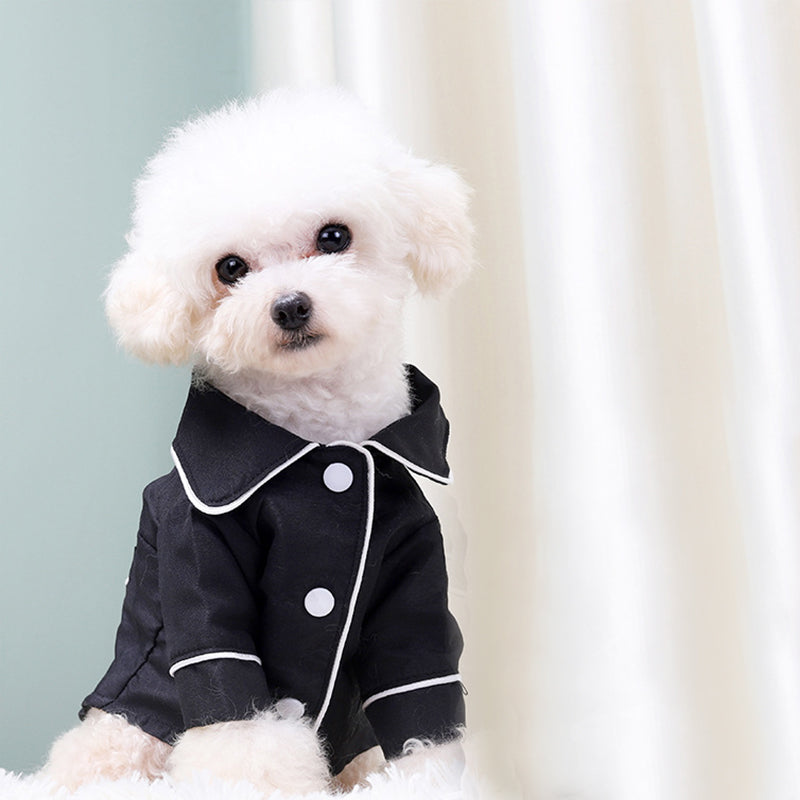 Pet Zen dog pajamas jacket, black with white piping and white buttons, fluffy white dog on Tampa Home & Garden Store