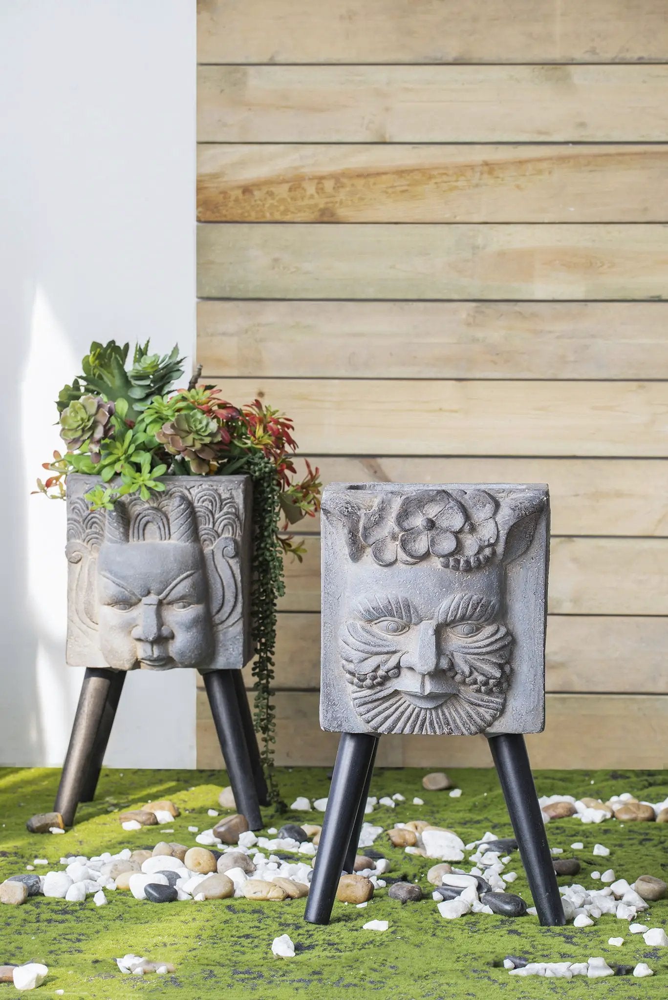 Gray Greek God statue planters on black tripod legs, carved-face pair with succulents Unique Piece Furniture on Tampa Home & Garden Store