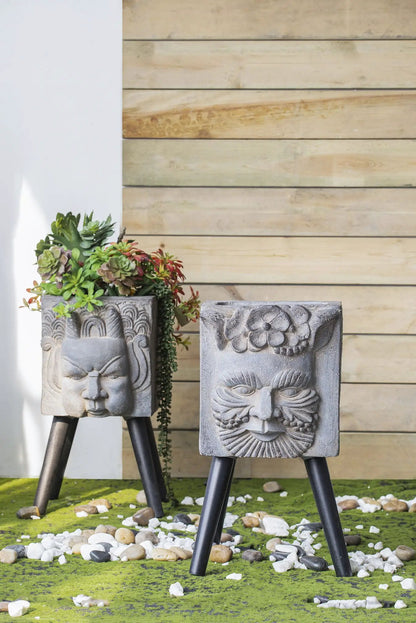 Gray Greek God statue planters on black tripod legs, carved-face pair with succulents Unique Piece Furniture on Tampa Home & Garden Store