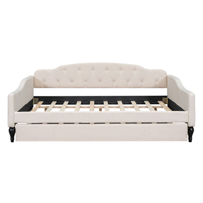 Upholstered tufted daybed in beige fabric with curved arms and visible slatted bed frame on Tampa Home & Garden Store