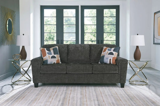 Erinslane stationary sofa in dark charcoal fabric with geometric throw pillows on Tampa Home & Garden Store