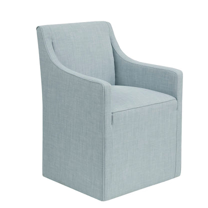 Traditional skirted dining arm chair with hidden casters in light blue gray fabric on Tampa Home & Garden Store