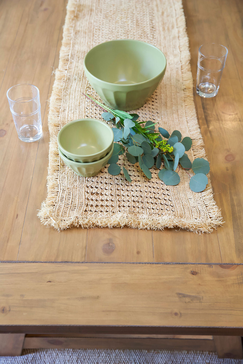 Payton James Lazio Crochet Raffia Table Runner, natural beige weave with two green bowls on Tampa Home & Garden Store