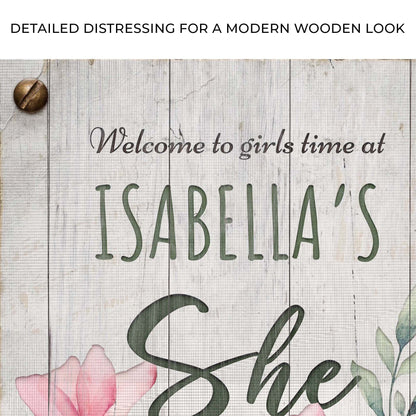 She Shed Sign IV canvas by Tailored Canvases with wood backdrop, green script and pink blooms on Tampa Home & Garden Store