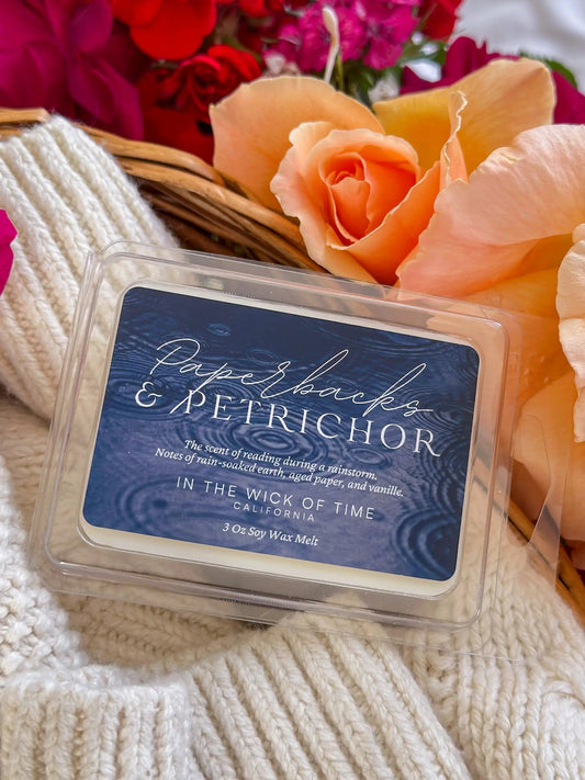 Wax melt Paperbacks & Petrichor by In the Wick of Time in a clamshell with label and peach rose on Tampa Home & Garden Store