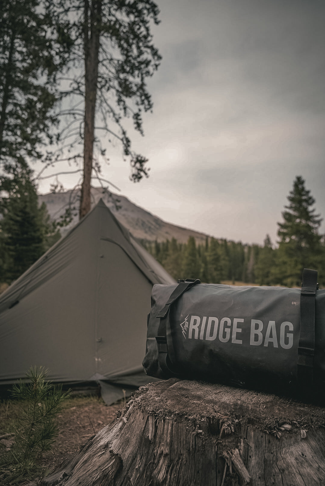 Ridge Bag medium outdoor duffel in dark gray fabric with black straps and Ridge Belts branding on Tampa Home & Garden Store