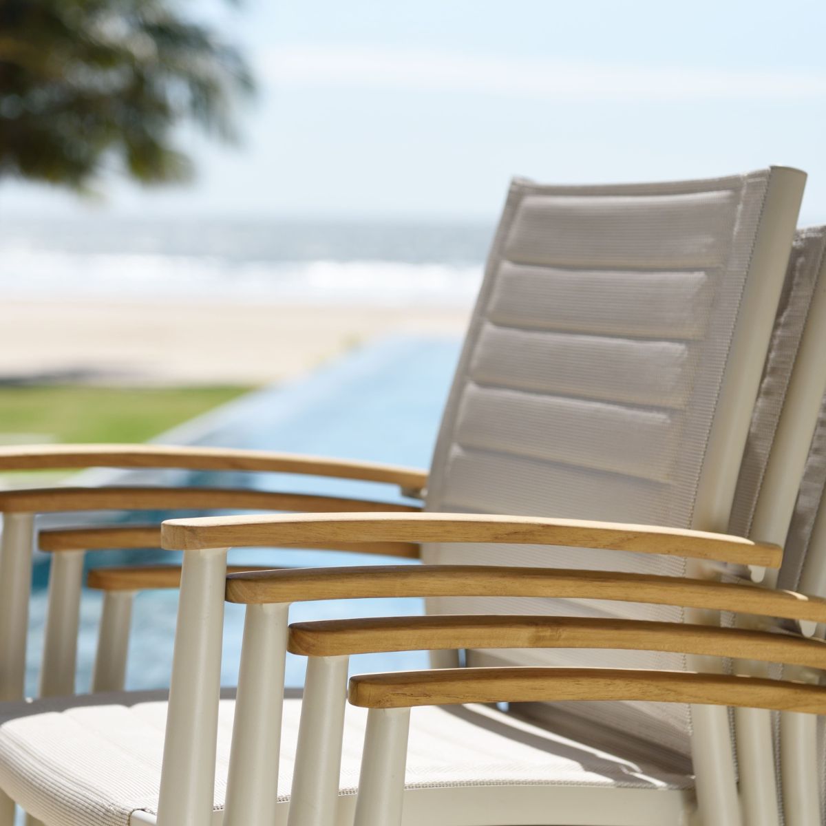 Portals Light Lite 2pc stacking outdoor chairs LifestyleGarden fabric seats with wood arms on Tampa Home & Garden Store