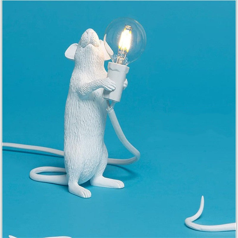 Postmodern resin mouse table lamp white figure holding LED bulb with cord Stevvex on Tampa Home & Garden Store