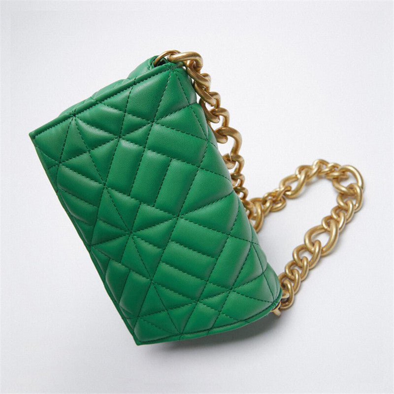 Shoulder bag in green quilted design with thick gold chain strap on Tampa Home & Garden Store