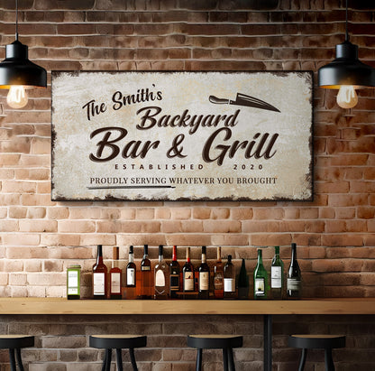 Canvas sign Backyard Bar & Grill Sign XVI by Tailored Canvases on brick wall with bottles on Tampa Home & Garden Store