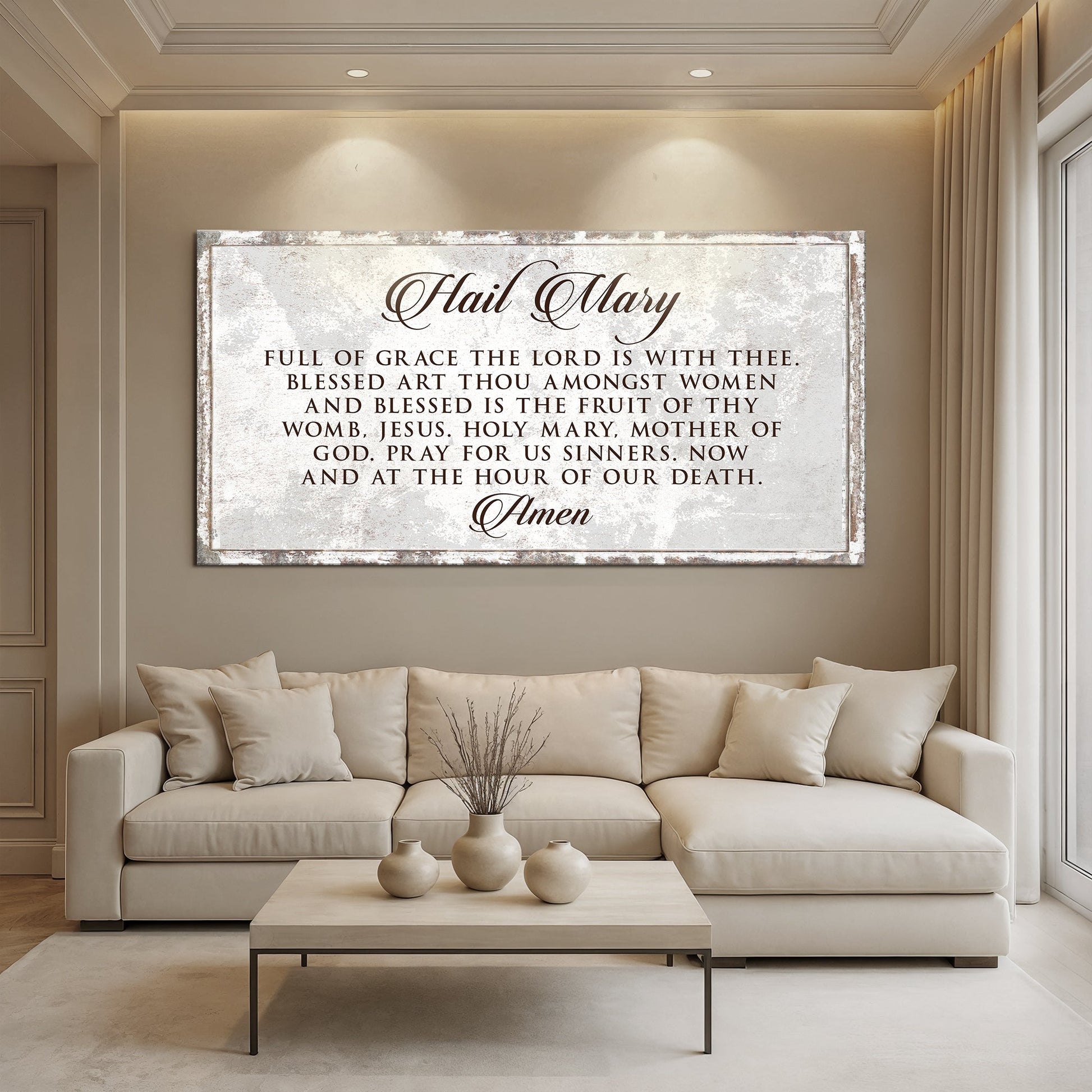 The Hail Mary Faith Sign II canvas with distressed silver frame above a neutral living room on Tampa Home & Garden Store