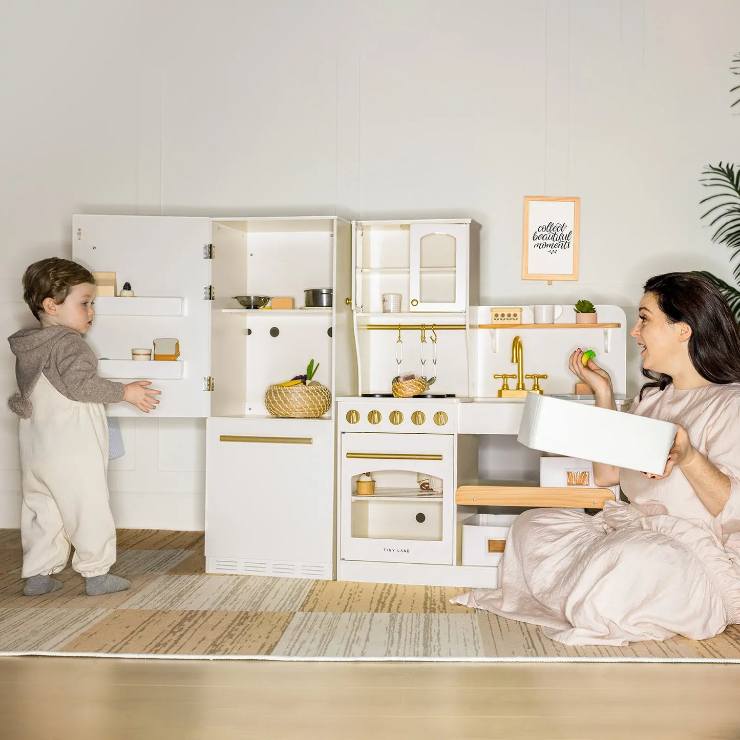 Tiny Land white play kitchen fridge with gold hardware; child and parent playing on Tampa Home & Garden Store