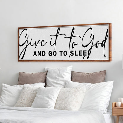 Canvas sign framed in wood with black script Give It To God And Go To Sleep above bed on Tampa Home & Garden Store
