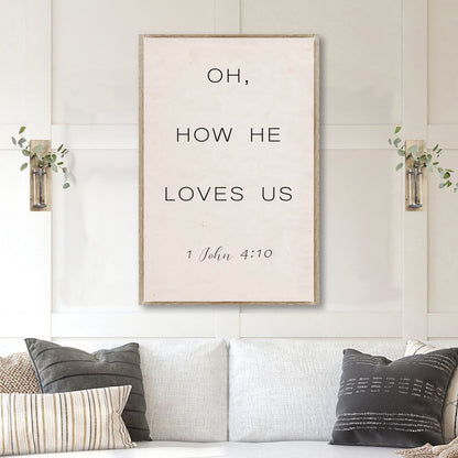 Canvas faith sign with beige wood frame reading Oh, How He Loves Us and 1 John 4:10 on Tampa Home & Garden Store
