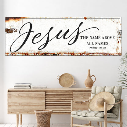 Jesus canvas wall sign with large script and Philippians 2:9 verse, rustic weathered edges on Tampa Home & Garden Store