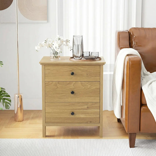 3-Drawer wooden nightstand with metal slides in oak finish, black knob pulls, glass vase on top on Tampa Home & Garden Store