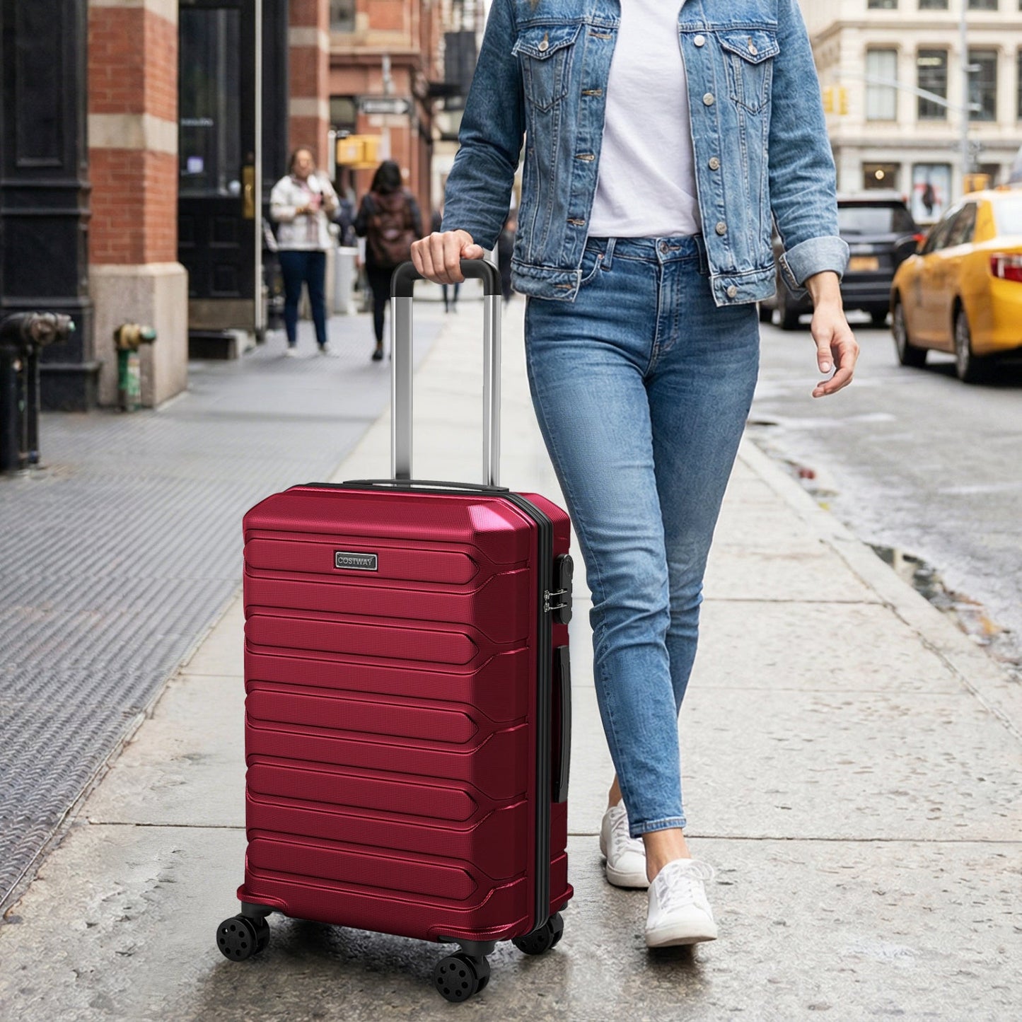 GemGear 3-Piece hardside luggage set red suitcase with 8-spinner wheels on a city sidewalk on Tampa Home & Garden Store