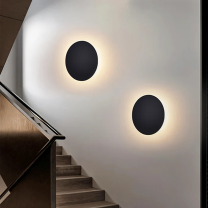 Modern LED Wall Lamp by Moktan Sabai, set of 2 black circular wall sconces with warm halo on Tampa Home & Garden Store