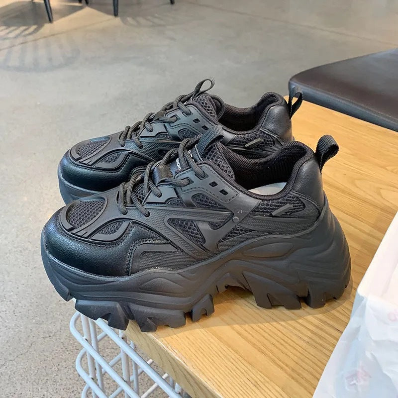 Pair of Stevvex chunky black platform sneakers with mesh panels and thick soles on Tampa Home & Garden Store
