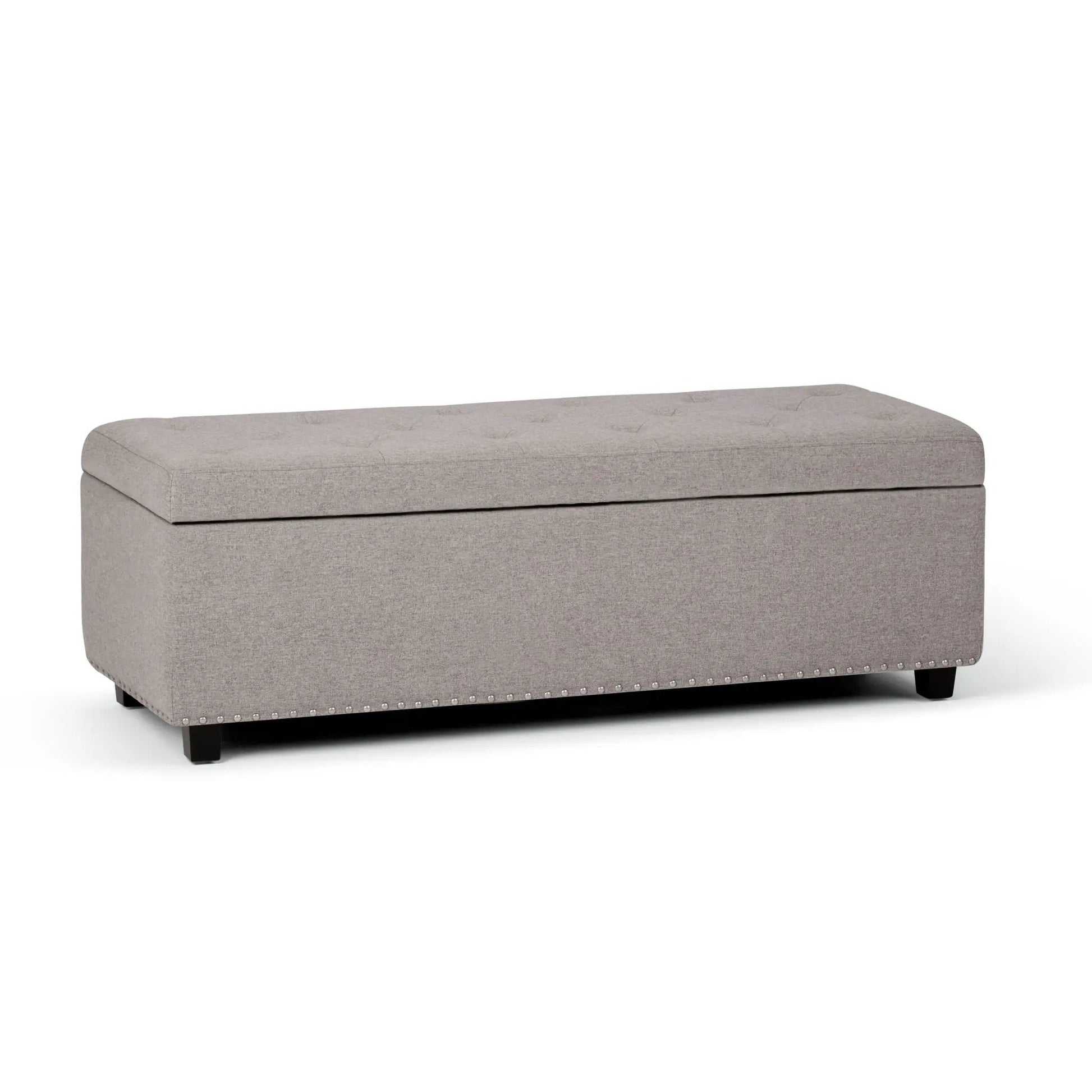 Hamilton Upholstered Storage Ottoman, light gray fabric with nailhead trim on wood legs on Tampa Home & Garden Store