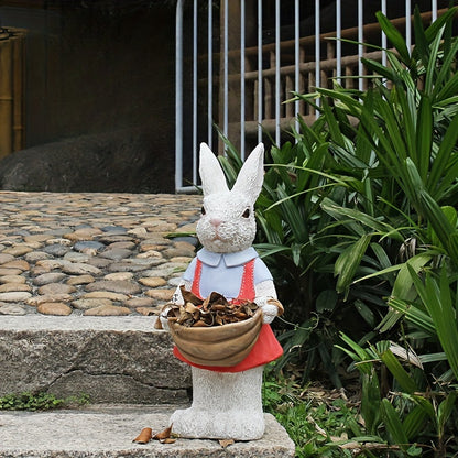 Charming rabbit garden statue HouseOfZazla, white bunny in blue shirt carrying a basket on Tampa Home & Garden Store