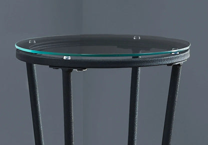Round glass-top accent side table with black metal frame and turquoise edge ring on Tampa Home & Garden Store