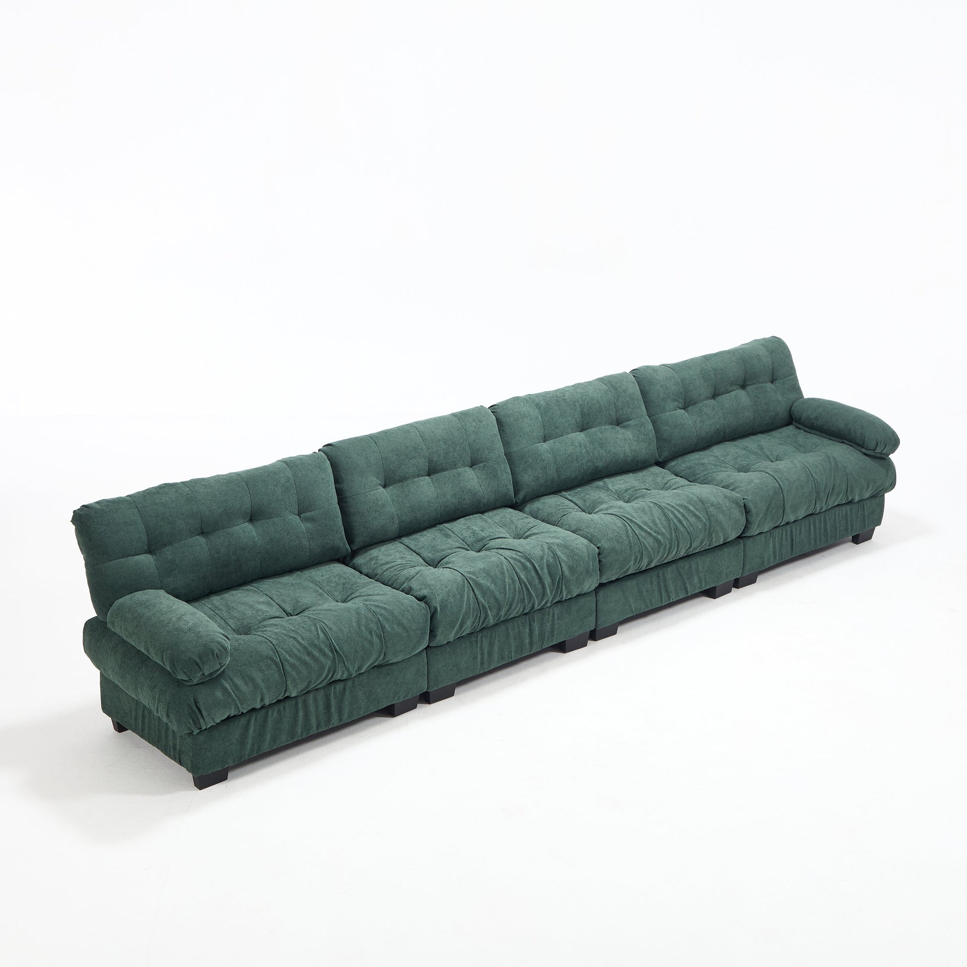 Modular sectional sofa Cloud Couch in deep green tufted fabric with low-profile black feet on Tampa Home & Garden Store