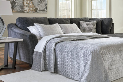 Biddeford stationary sectional sofa in dark gray fabric with quilted pillows on Tampa Home & Garden Store