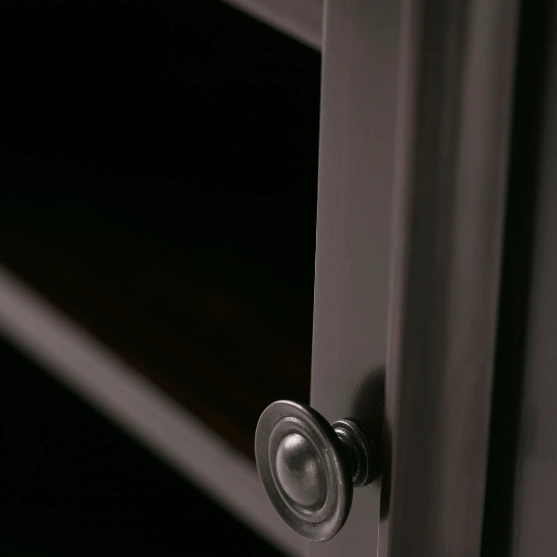 Amherst TV Media Stand handcrafted close-up of dark metal hardware and bolts on leg on Tampa Home & Garden Store