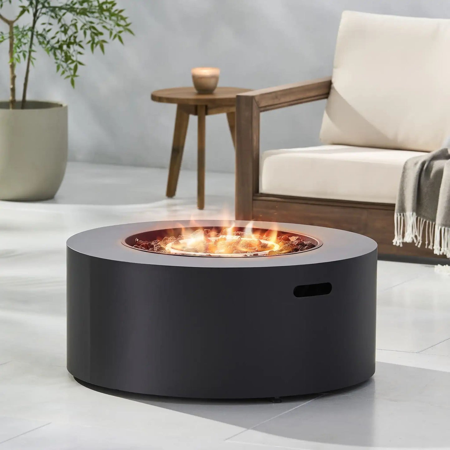 Round iron fire pit with 40,000 BTU flame, black steel outdoor fireplace on Tampa Home & Garden Store