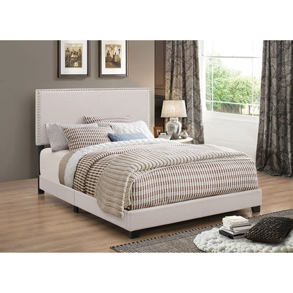Ivory upholstered platform bed with nailhead trim by HouseOfZazla in a neutral bedroom on Tampa Home & Garden Store