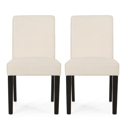 Pair of contemporary dining chairs with cream upholstery and black tapered legs by HouseOfZazla on Tampa Home & Garden Store