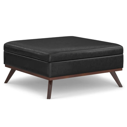 Owen multifunctional square coffee table storage ottoman in black faux leather with angled wood legs on Tampa Home & Garden Store