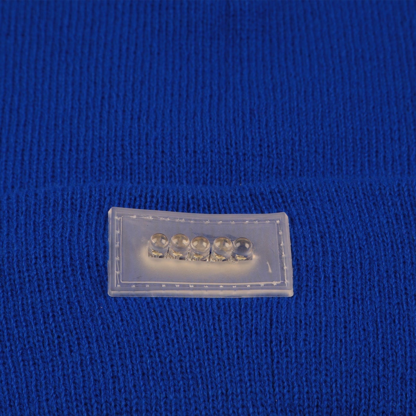 GemGear five LED headlamp components in a clear plastic case on blue knit fabric on Tampa Home & Garden Store