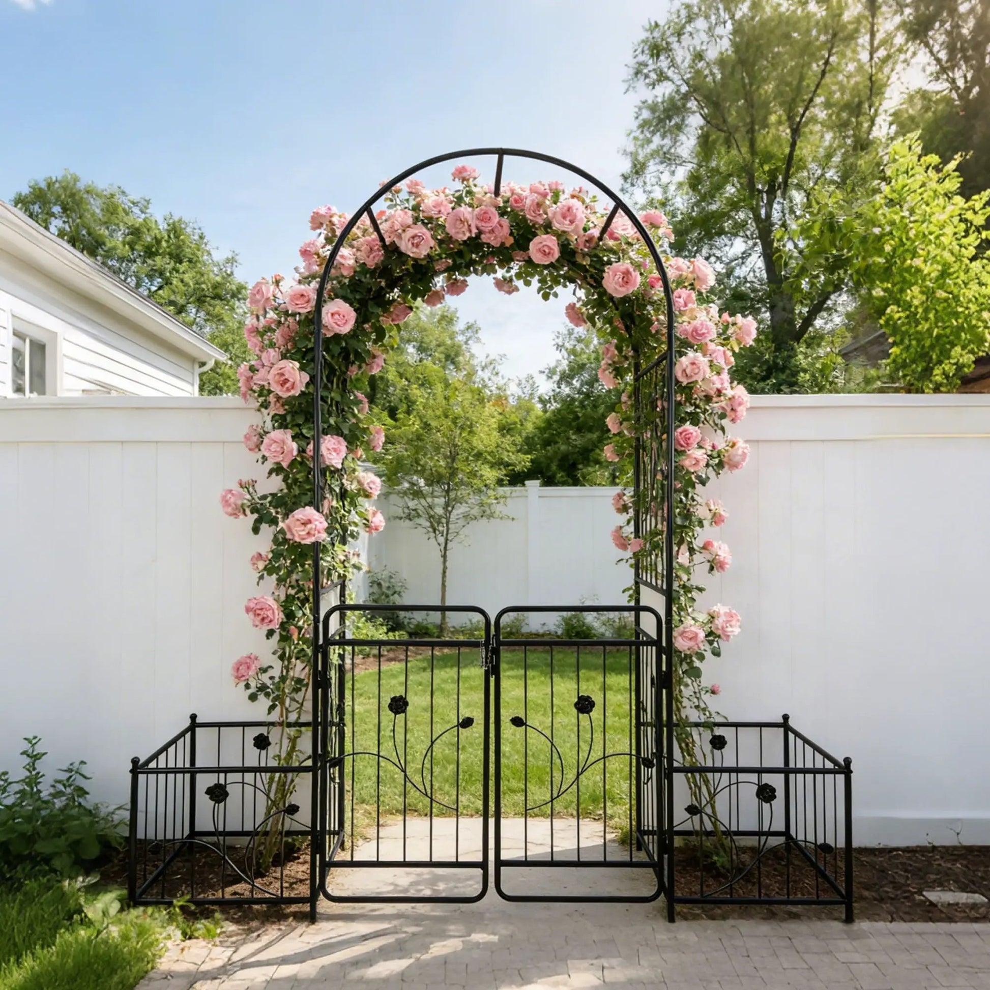 Metal garden arch with gate, black iron frame, climbing pink roses on Tampa Home & Garden Store