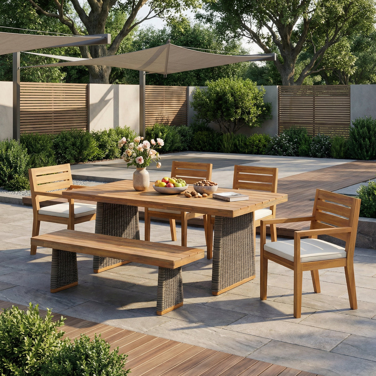 Outdoor acacia wood patio dining set with bench seating and wicker-wrapped pedestal bases on Tampa Home & Garden Store