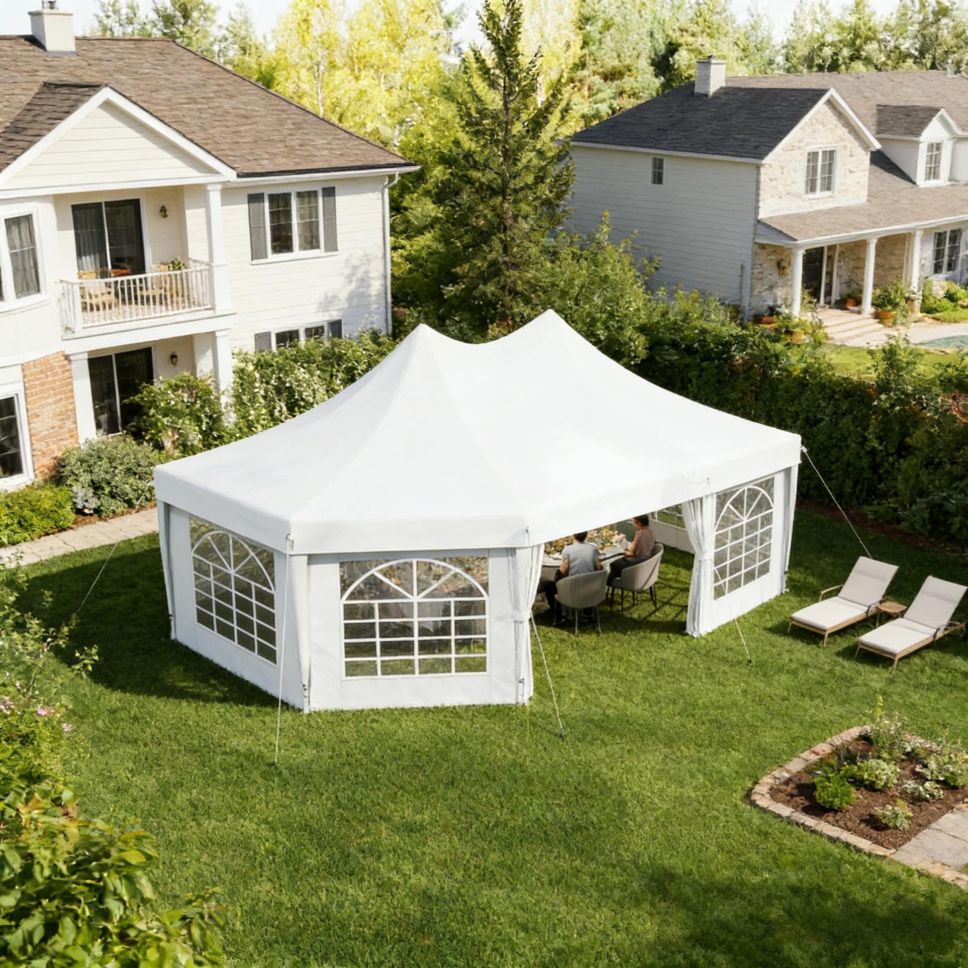 Extra Large Event Tent white canopy with windowed walls in a residential backyard on Tampa Home & Garden Store