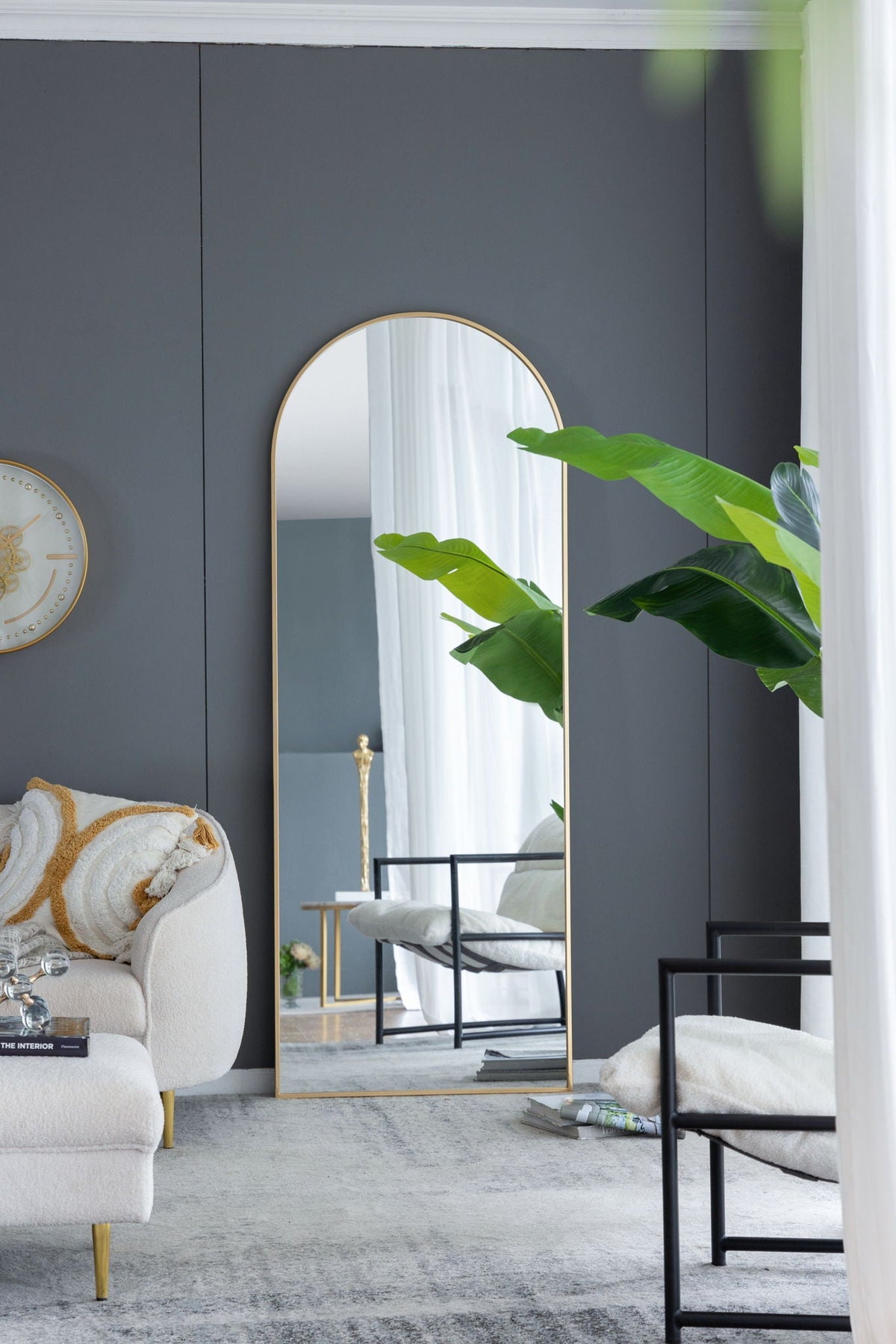 The Celine Arch Body Mirror with slim gold frame and arched top, HouseOfZazla floor mirror on dark wall on Tampa Home & Garden Store