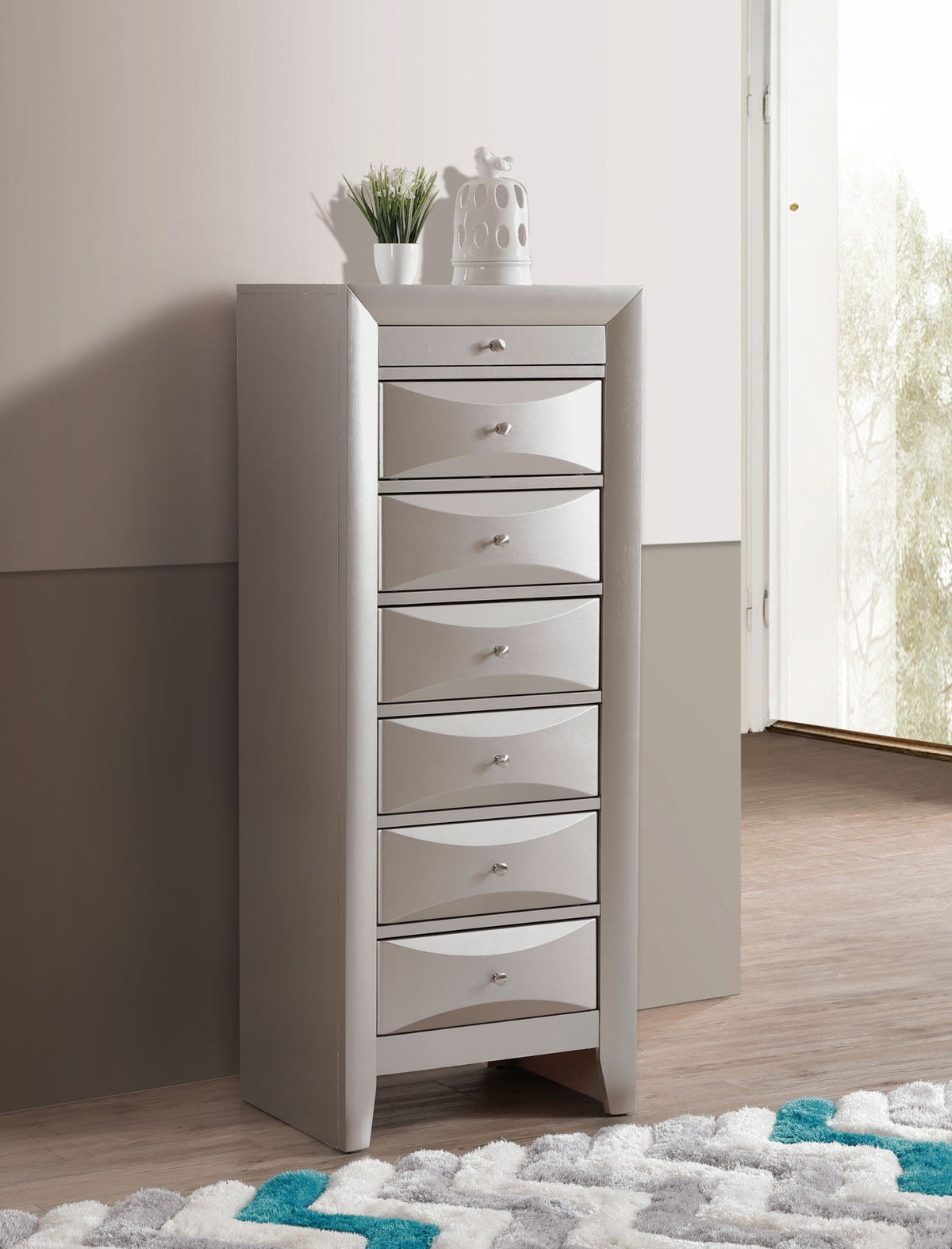 7 Drawer Lingerie Chest with Sleek Storage, knob pulls, topped by plant and ceramic bird on Tampa Home & Garden Store