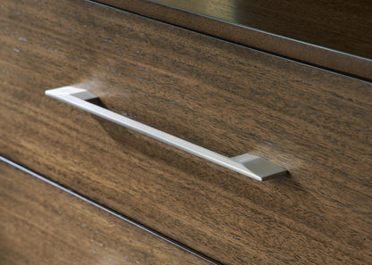 Dresser drawer front in dark wood with a long silver metal handle on Tampa Home & Garden Store