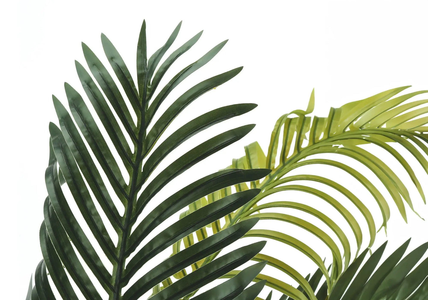 Artificial palm plant fronds close-up in dark green and lime green leaves on Tampa Home & Garden Store
