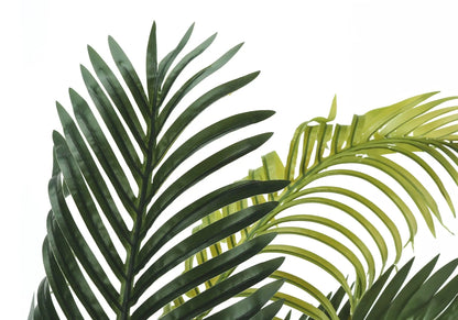 Artificial palm plant fronds close-up in dark green and lime green leaves on Tampa Home & Garden Store