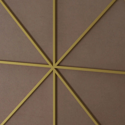Wall mirror with yellow metal frame in a geometric diamond layout on pink textured wall on Tampa Home & Garden Store